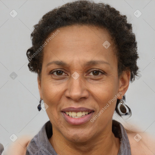 Joyful black adult female with short  brown hair and brown eyes