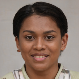 Joyful latino young-adult female with short  brown hair and brown eyes