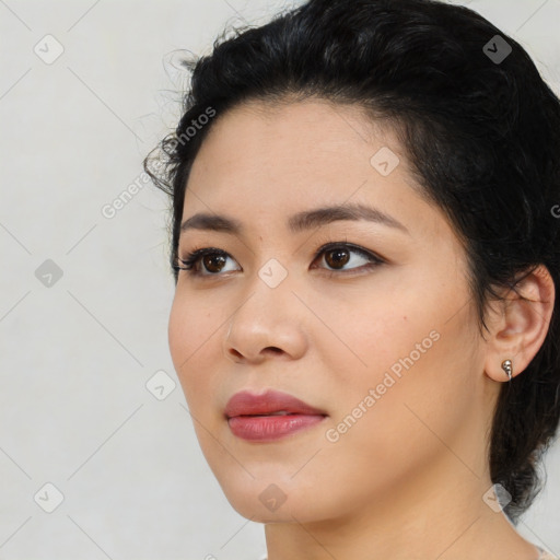 Joyful asian young-adult female with medium  black hair and brown eyes