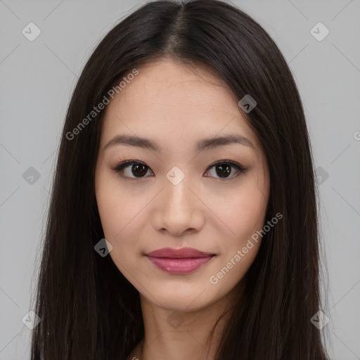 Joyful asian young-adult female with long  brown hair and brown eyes