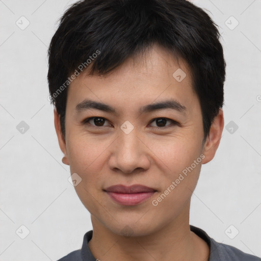 Joyful asian young-adult male with short  black hair and brown eyes