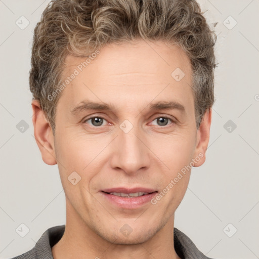 Joyful white adult male with short  brown hair and grey eyes