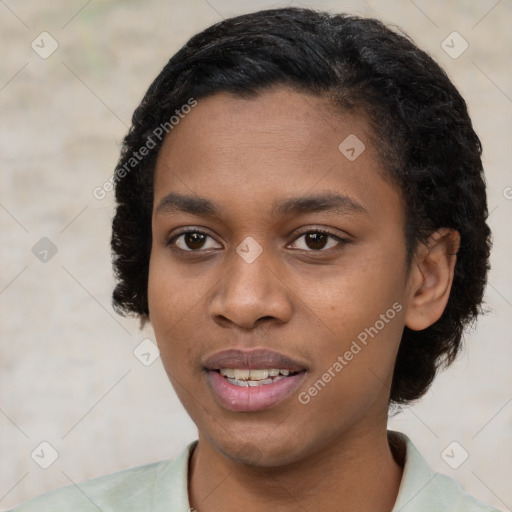 Joyful black young-adult female with short  black hair and brown eyes