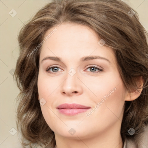 Joyful white young-adult female with medium  brown hair and green eyes