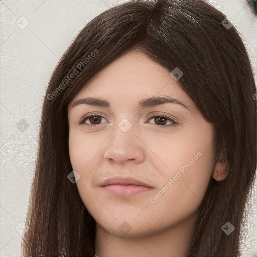 Neutral white young-adult female with long  brown hair and brown eyes