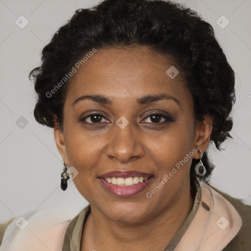 Joyful black adult female with short  brown hair and brown eyes