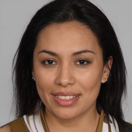 Joyful latino young-adult female with medium  brown hair and brown eyes