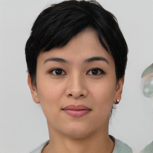 Joyful asian young-adult female with short  black hair and brown eyes