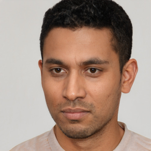 Neutral latino young-adult male with short  black hair and brown eyes