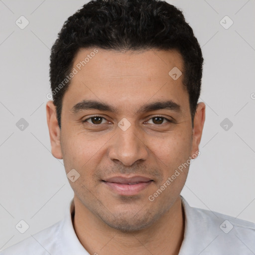 Joyful white young-adult male with short  black hair and brown eyes