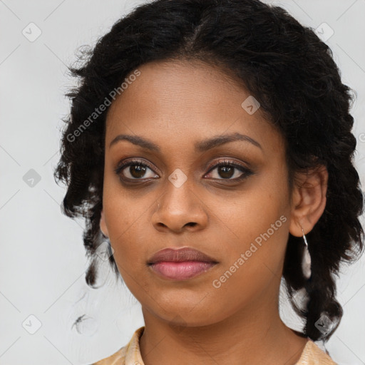 Joyful black young-adult female with long  brown hair and brown eyes