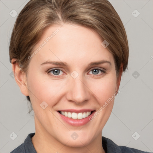 Joyful white young-adult female with short  brown hair and grey eyes