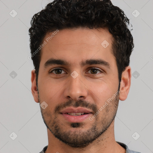 Joyful white young-adult male with short  black hair and brown eyes