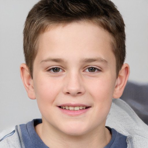 Joyful white child male with short  brown hair and brown eyes