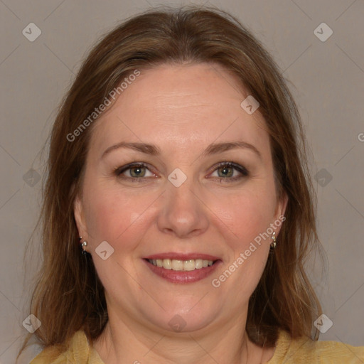 Joyful white adult female with medium  brown hair and grey eyes