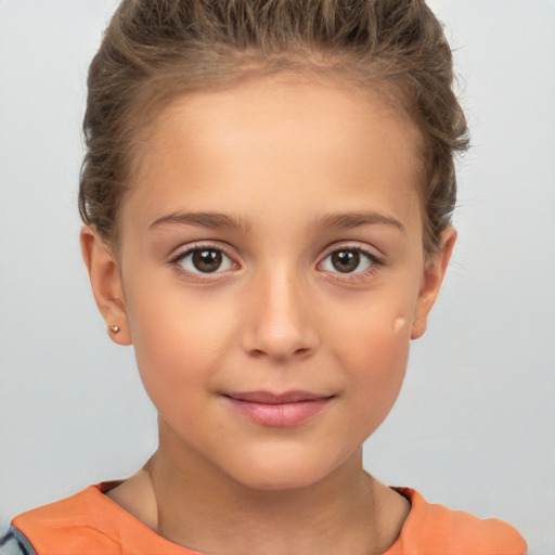 Joyful white child female with short  brown hair and brown eyes