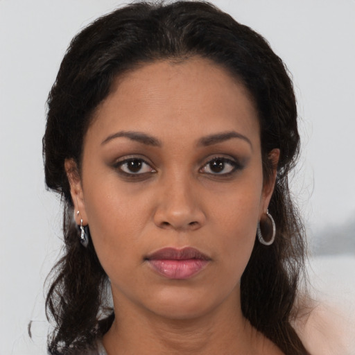 Neutral latino young-adult female with long  brown hair and brown eyes