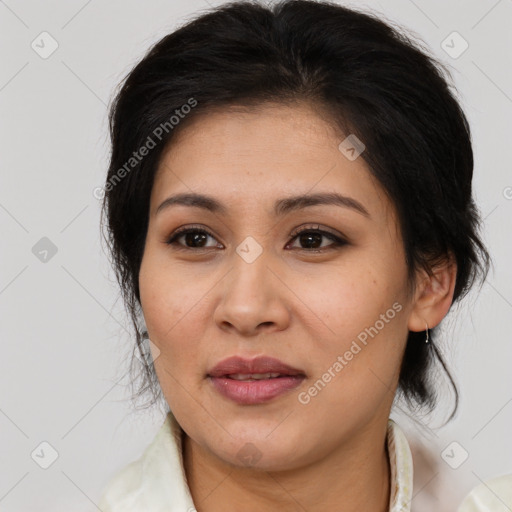Joyful latino young-adult female with medium  brown hair and brown eyes