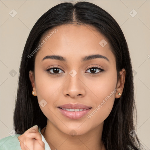 Joyful latino young-adult female with long  black hair and brown eyes