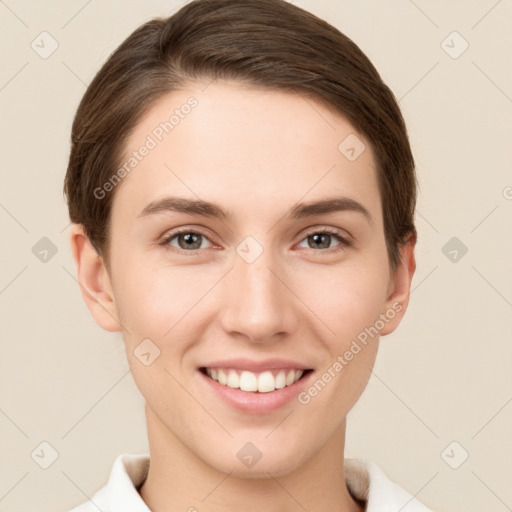 Joyful white young-adult female with short  brown hair and brown eyes