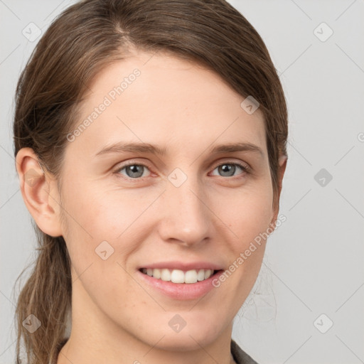 Joyful white young-adult female with long  brown hair and grey eyes