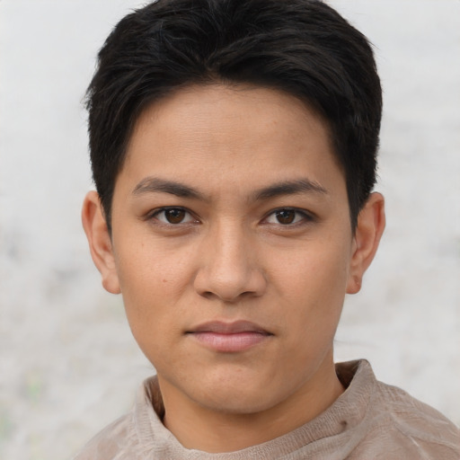 Joyful asian young-adult female with short  brown hair and brown eyes
