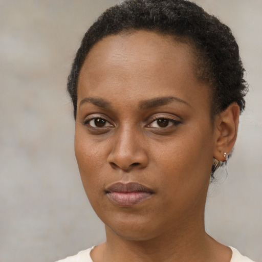 Neutral black young-adult female with short  brown hair and brown eyes