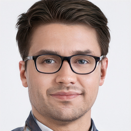 Joyful white young-adult male with short  brown hair and grey eyes