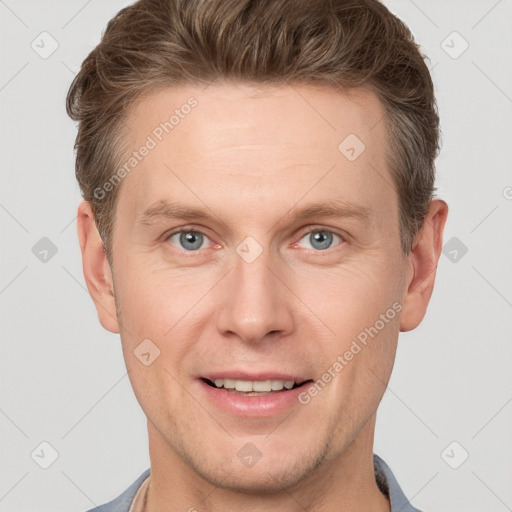 Joyful white adult male with short  brown hair and grey eyes