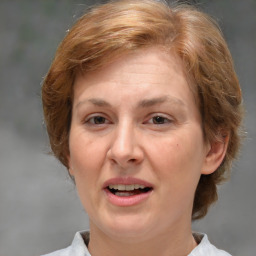 Joyful white adult female with medium  brown hair and brown eyes