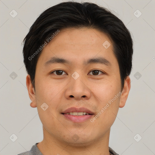 Joyful asian young-adult male with short  brown hair and brown eyes