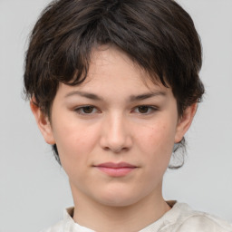 Joyful white child female with medium  brown hair and brown eyes