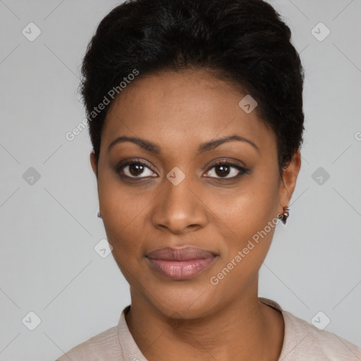 Joyful black young-adult female with short  brown hair and brown eyes