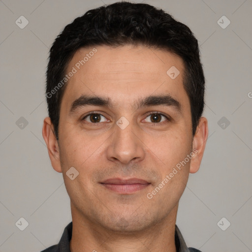 Joyful white young-adult male with short  black hair and brown eyes