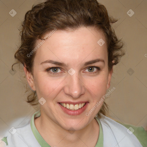 Joyful white young-adult female with medium  brown hair and green eyes