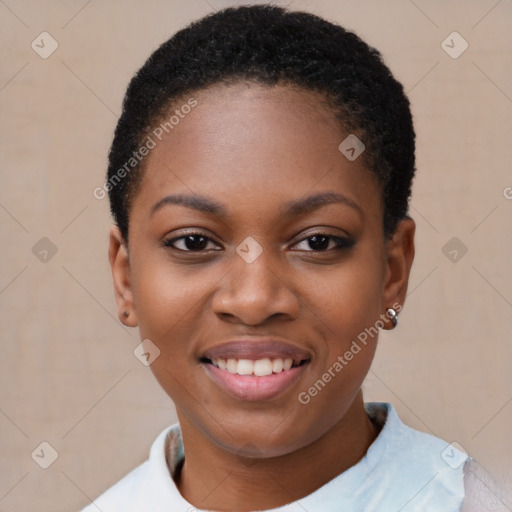 Joyful black young-adult female with short  black hair and brown eyes