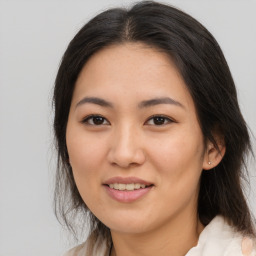 Joyful white young-adult female with medium  brown hair and brown eyes