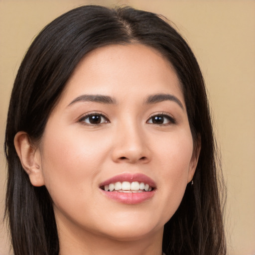 Joyful white young-adult female with long  brown hair and brown eyes