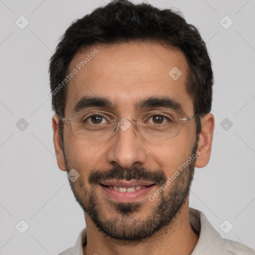 Joyful white young-adult male with short  black hair and brown eyes