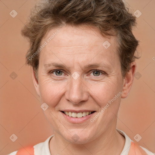 Joyful white adult female with short  brown hair and brown eyes