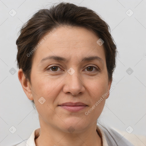 Joyful white adult female with short  brown hair and brown eyes