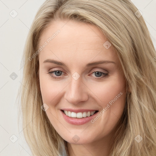 Joyful white young-adult female with long  brown hair and blue eyes