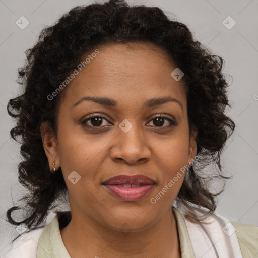 Joyful black adult female with medium  brown hair and brown eyes