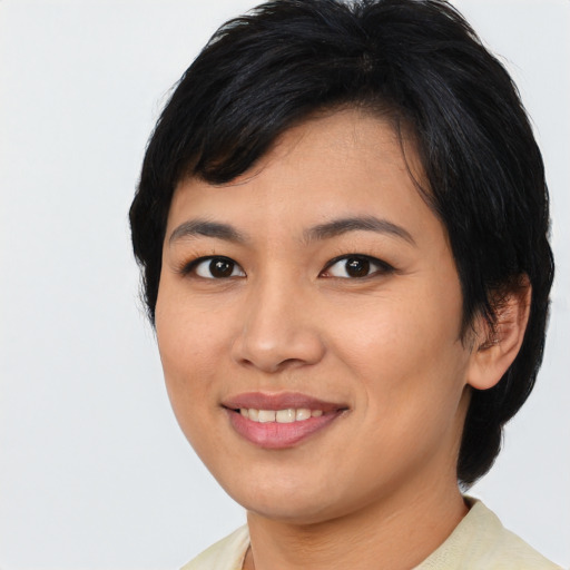 Joyful asian young-adult female with medium  black hair and brown eyes