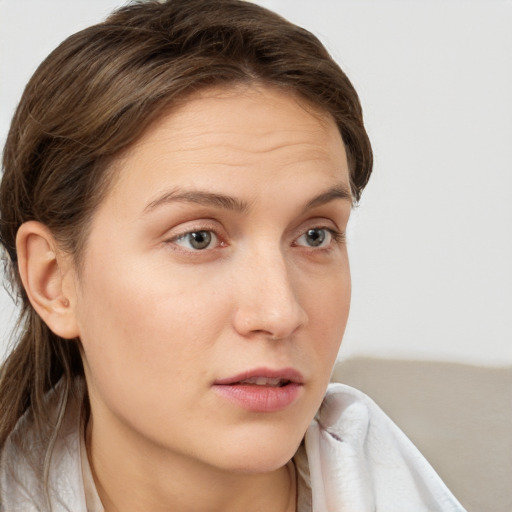 Neutral white young-adult female with medium  brown hair and grey eyes