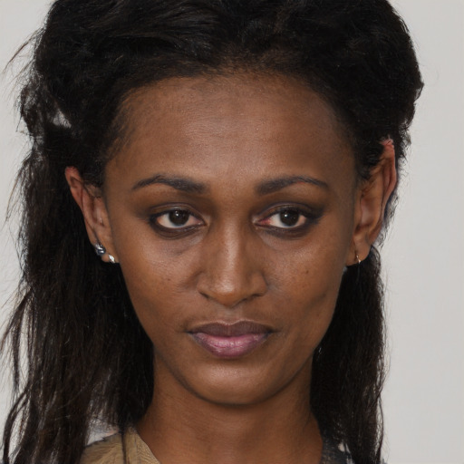 Neutral black young-adult female with long  brown hair and brown eyes