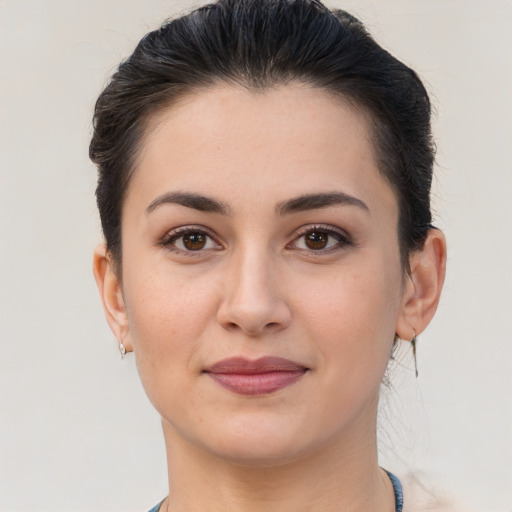 Joyful white young-adult female with short  brown hair and brown eyes