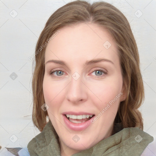 Joyful white young-adult female with medium  brown hair and blue eyes