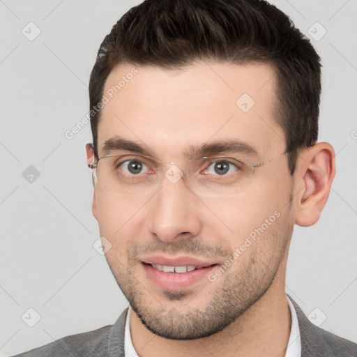 Joyful white young-adult male with short  brown hair and brown eyes