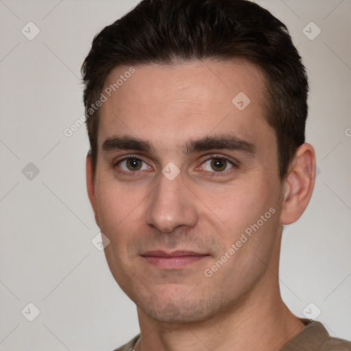 Joyful white young-adult male with short  brown hair and brown eyes